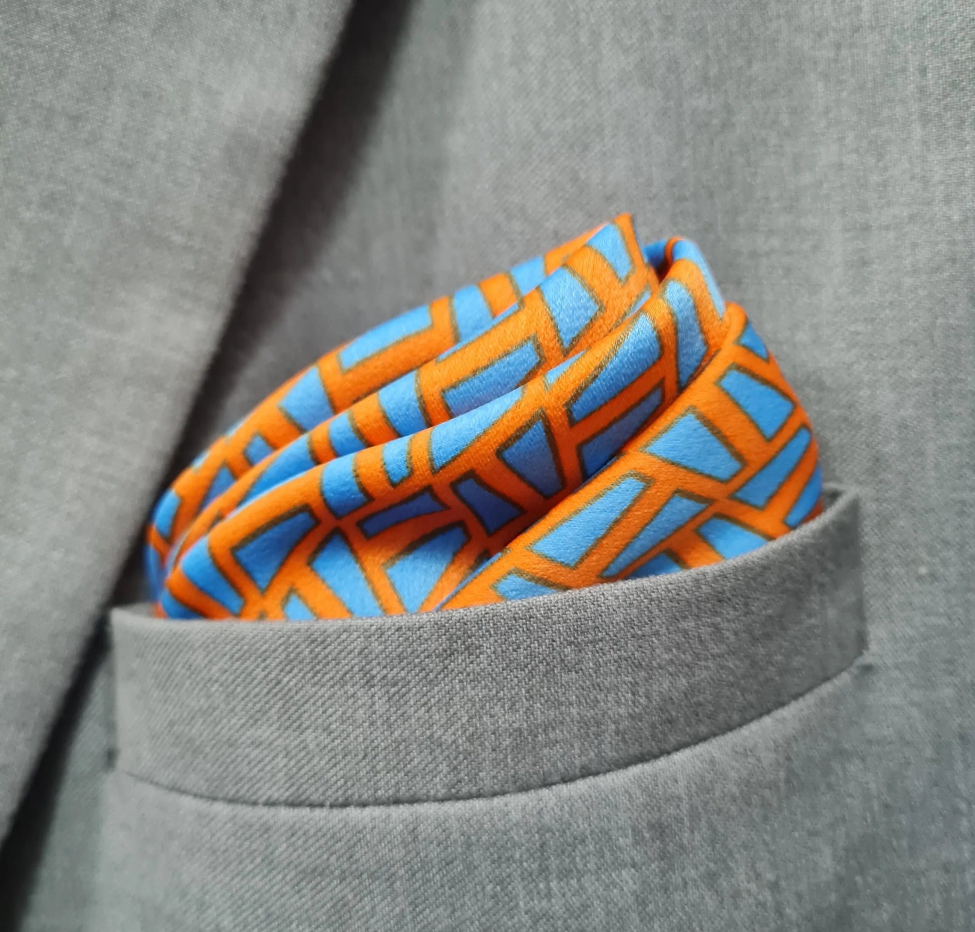 13 by 13 inches Vibrant Orange Base with Floating Blue Planks Pocket Square