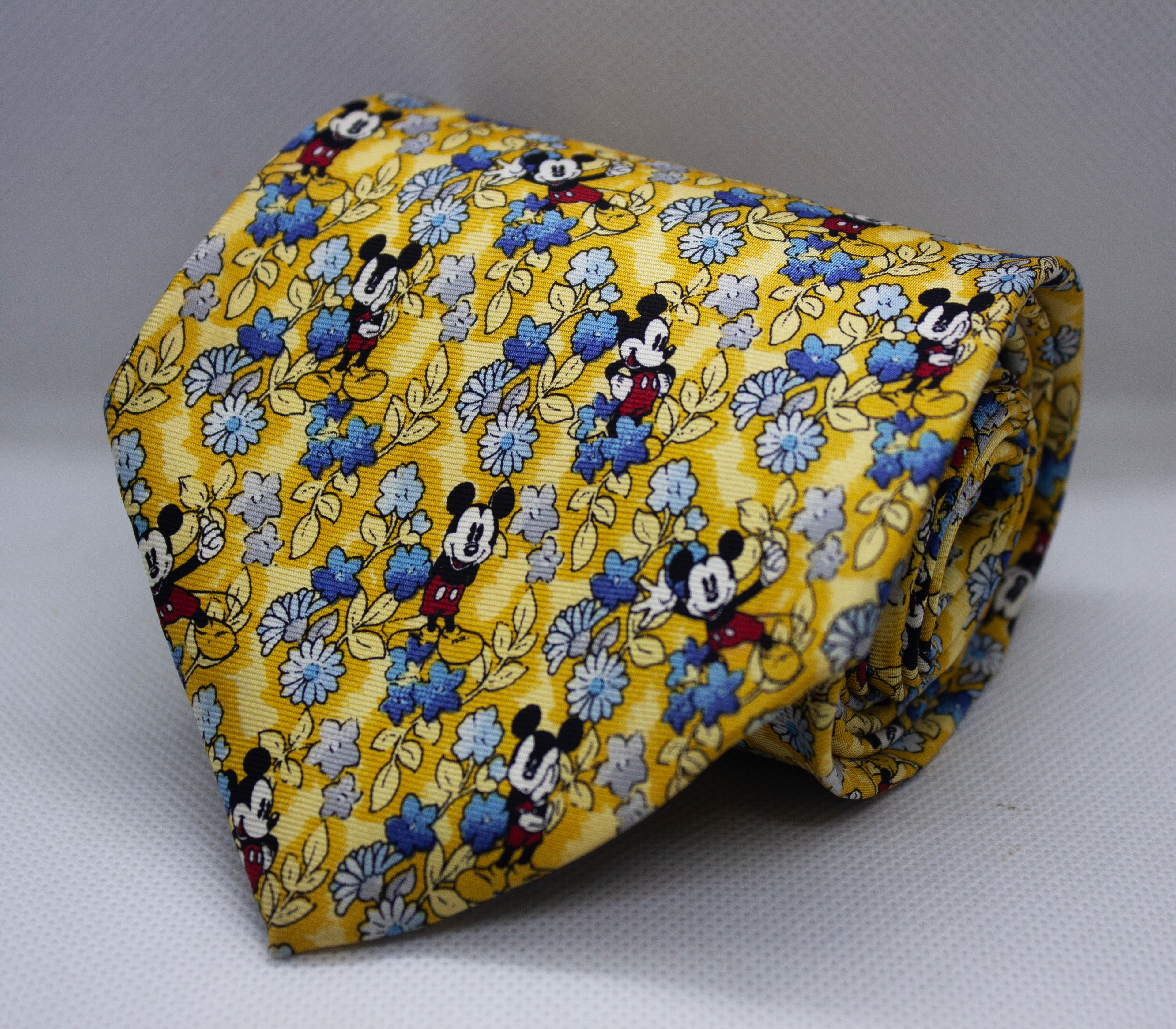 Golden Silk Broad Tie with Playful Floral & Character Motifs